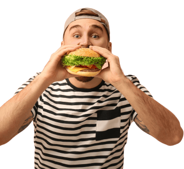 young man in a stripe t shirt eating delicious burger