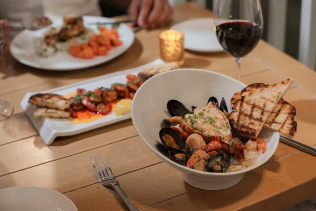 Guy Harvey's Boathouse Grill in George Town, on the waterfront with fresh seafood and Caribbean-inspired dishes.